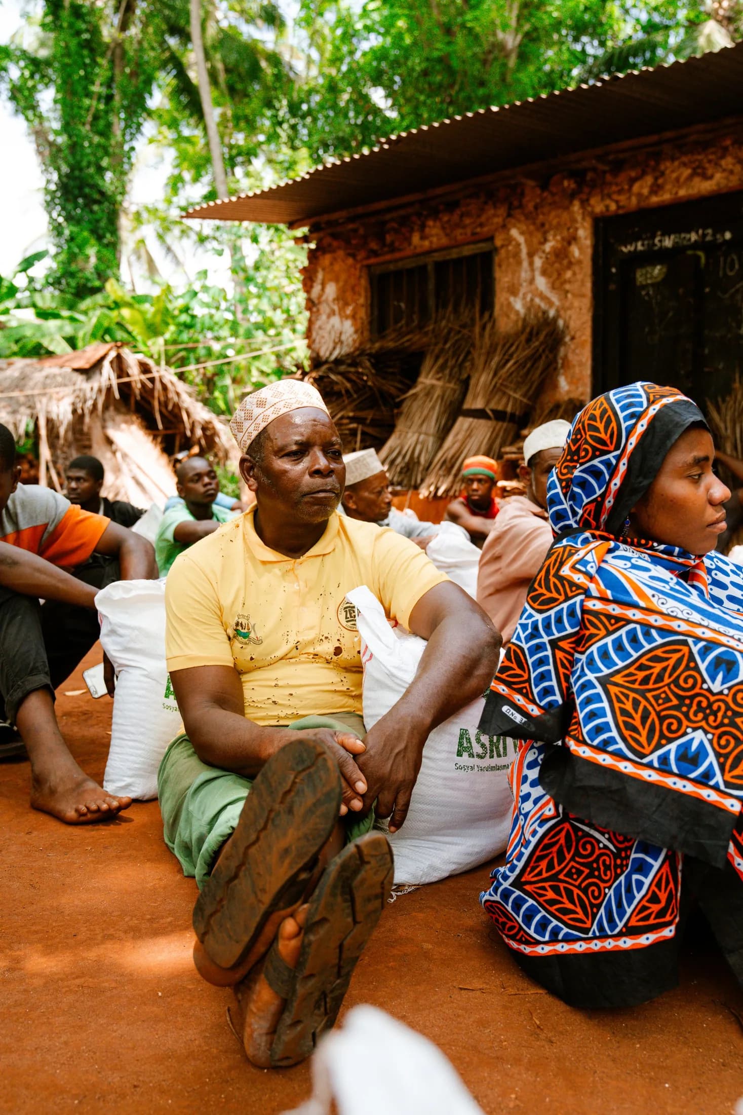 An East African community meeting; dignity-first documentary stock photography